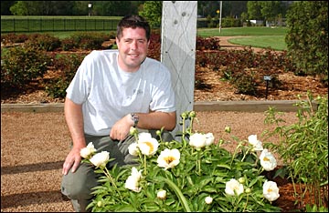Ed Moran with peonies at Reiman Gardens