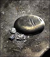 button of yttrium-silver