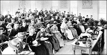 Botany class, ca. 1890, women in
hats nd dresses and men in suits and ties