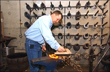 Dan White shaping a horse shoe