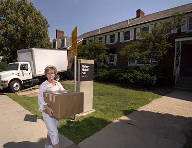 Carole Gieseke moving boxes into
Fisher-Nickell Hall
