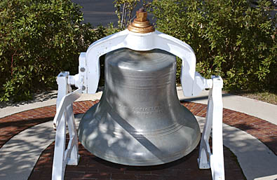 Bell in stand on brick bed