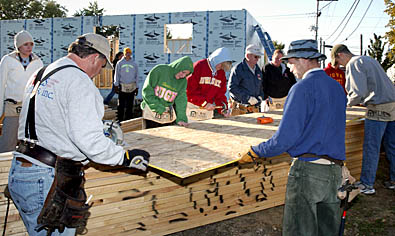 People working on the Habitat for Humanity house