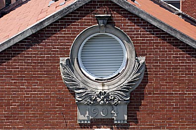 Brick building with vent and 1904