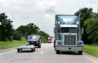 Solar car, Fusion, on an interstate next to a semi