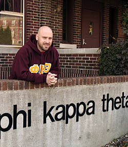 Dan Weimer standing in front of Phi Kappa
Theta fraternity
