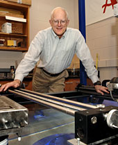 R. Bruce Thompson, pictured here with a
nondestructive evaluation device in his lab, will present the Fall 2005
Presidential University Lecture on Nov. 29. 