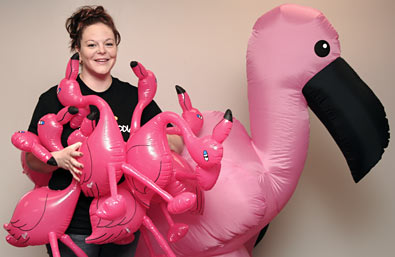 Sgt. Liz Gries with pink flamingos