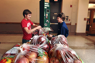 Hort Club members sells apples to customer.