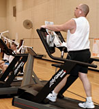Exerciser on treadmill