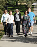 Employees walk on campus.