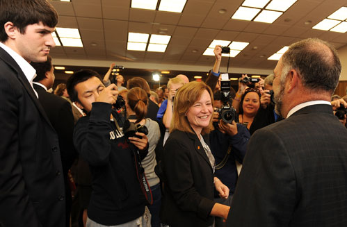 Photographers, well-wishers surround Leath